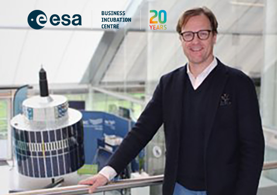 space business professional by the satellite at SBIC Noordwijk