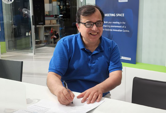 space business entrepreneur signing ESA BIC contract in the atrium at SBIC Noordwijk