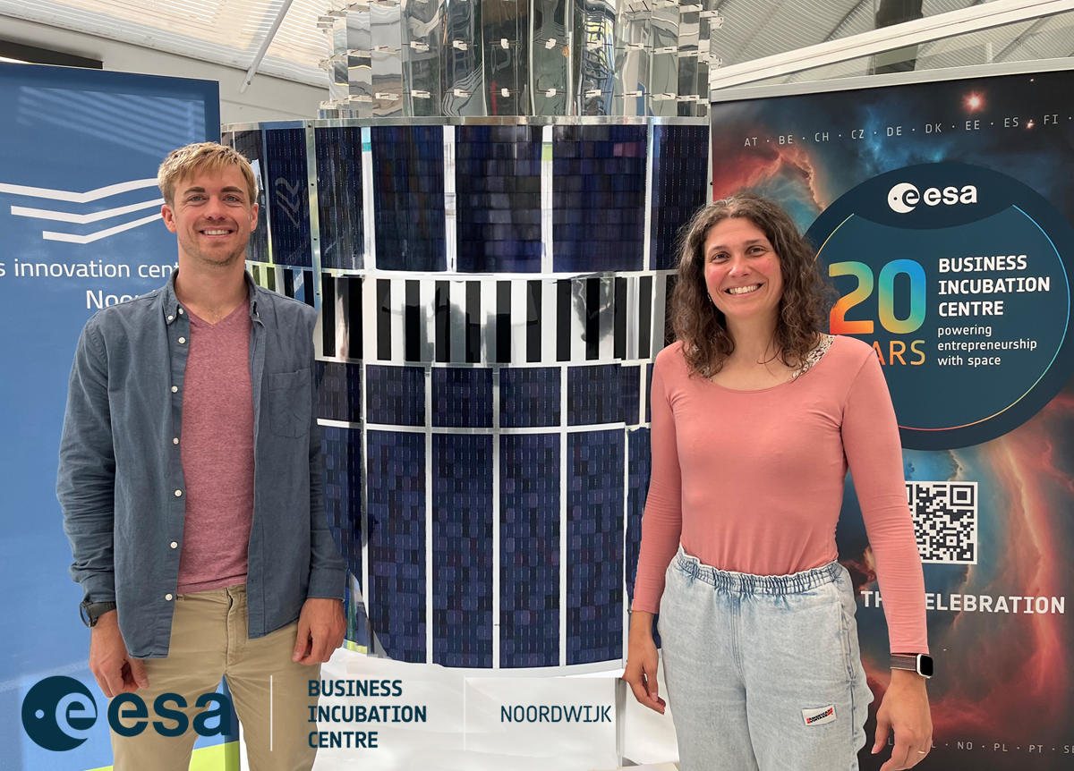 space business professionals stook by the satellite at ESA BIC Noordwijk