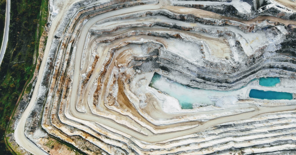 aerial view of a quarry with a blue pool