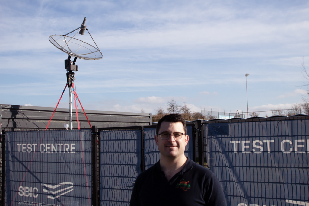 space business entrepreneur stood in front of the ground station at the test centre of SBIC Noordwijk