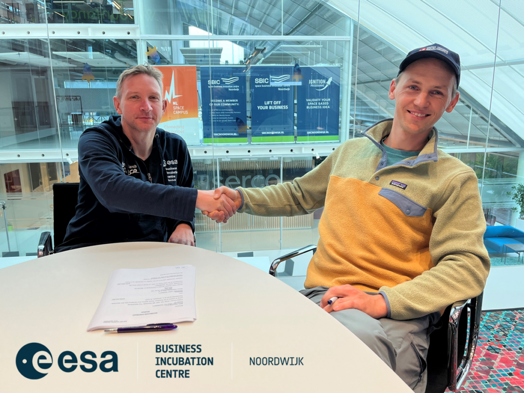 space business professionals shaking hands after signing incubation contact at ESA BIC Noordwijk