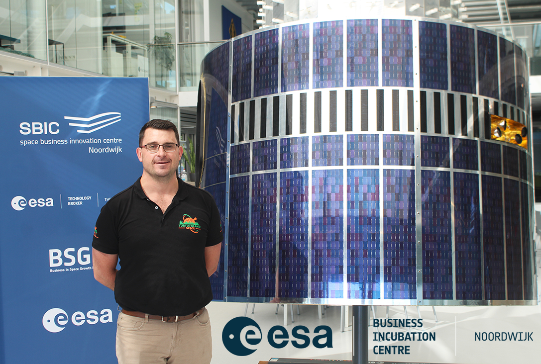 ESA BIC incubatee stood in front of the SBIC Noordwijk satellite